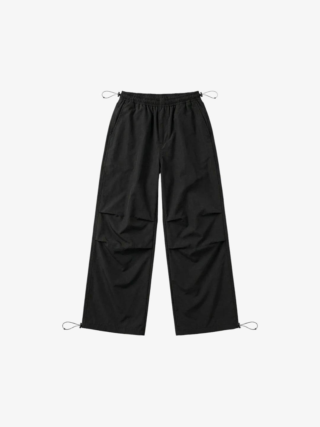 Black Y2K parachute pants front view with elastic waist