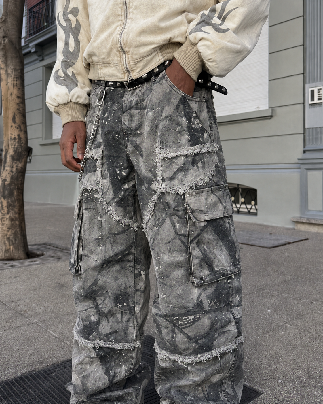 Grey camo cargo pants pocket and chain belt detail