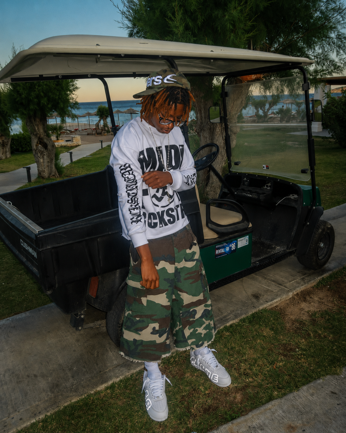 Camo Jorts worn in a full outfit with a white top