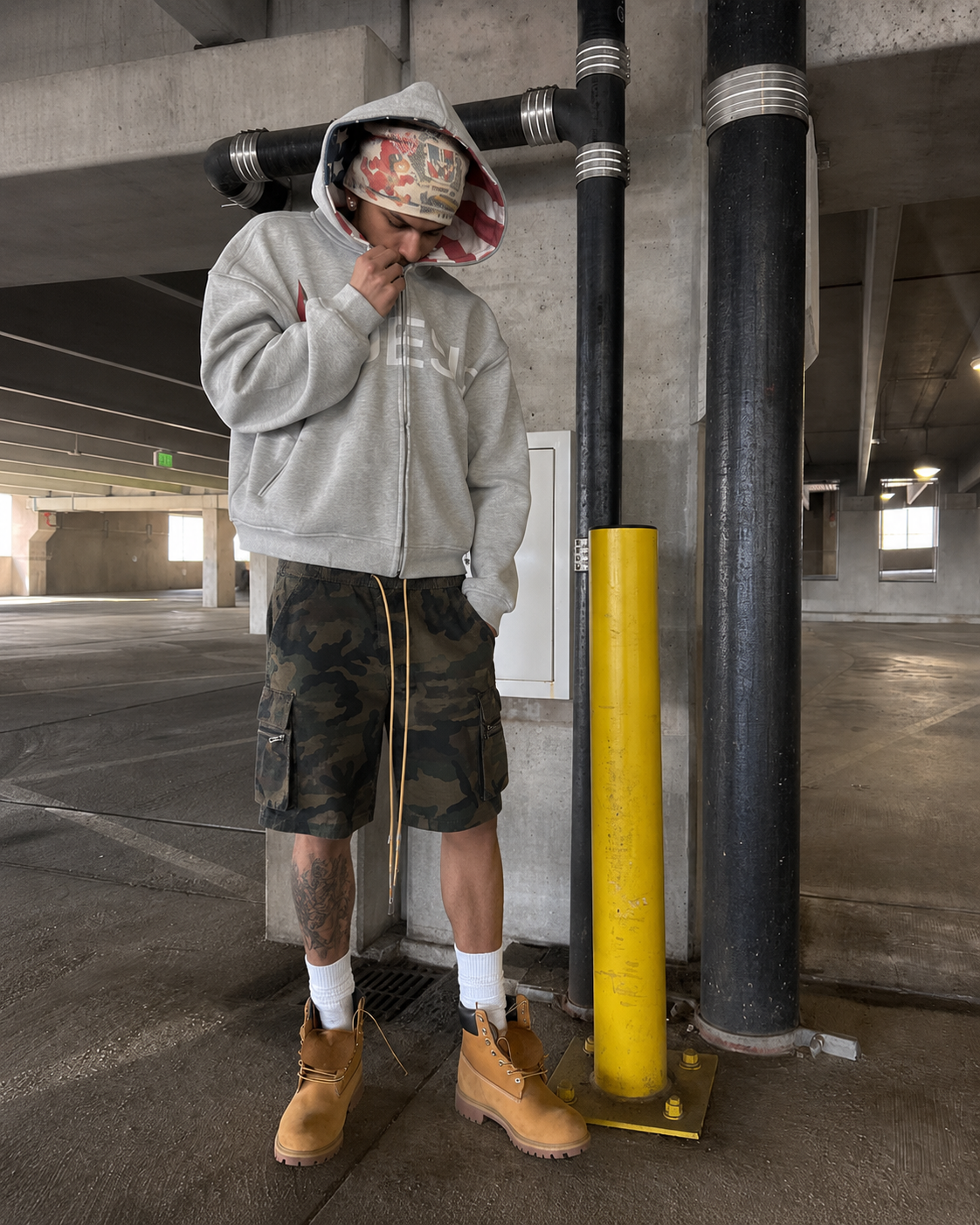Camo Shorts worn in a full outfit with grey hoodie and Timberlands