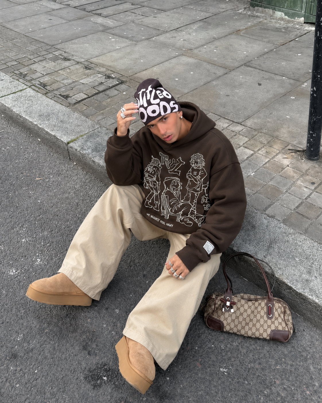 Brown Y2K cartoon hoodie worn by man streetwear