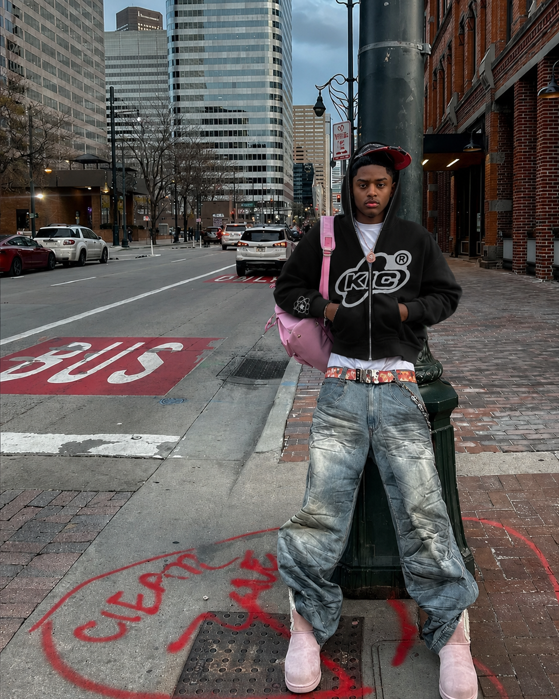 Black Y2K full zip hoodie worn in city with grey graphic