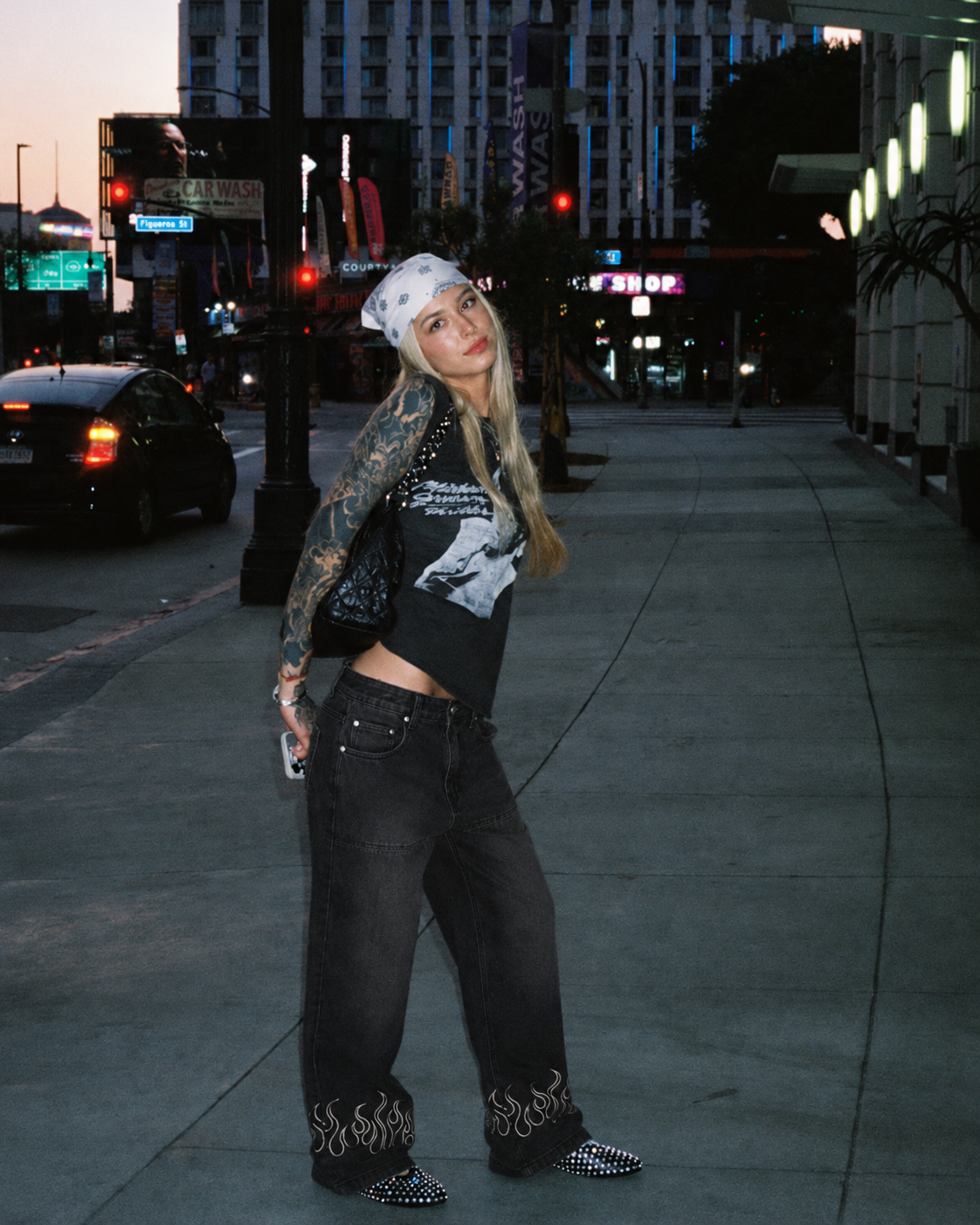 Black flame jeans worn with embroidered flame detail