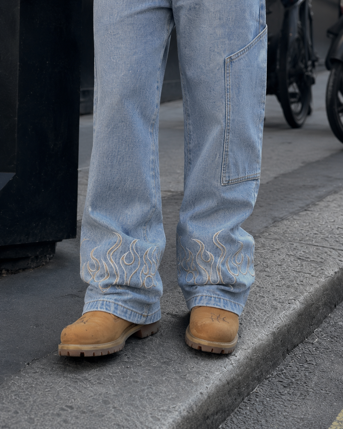 Blue flame jeans embroidered flame hem detail