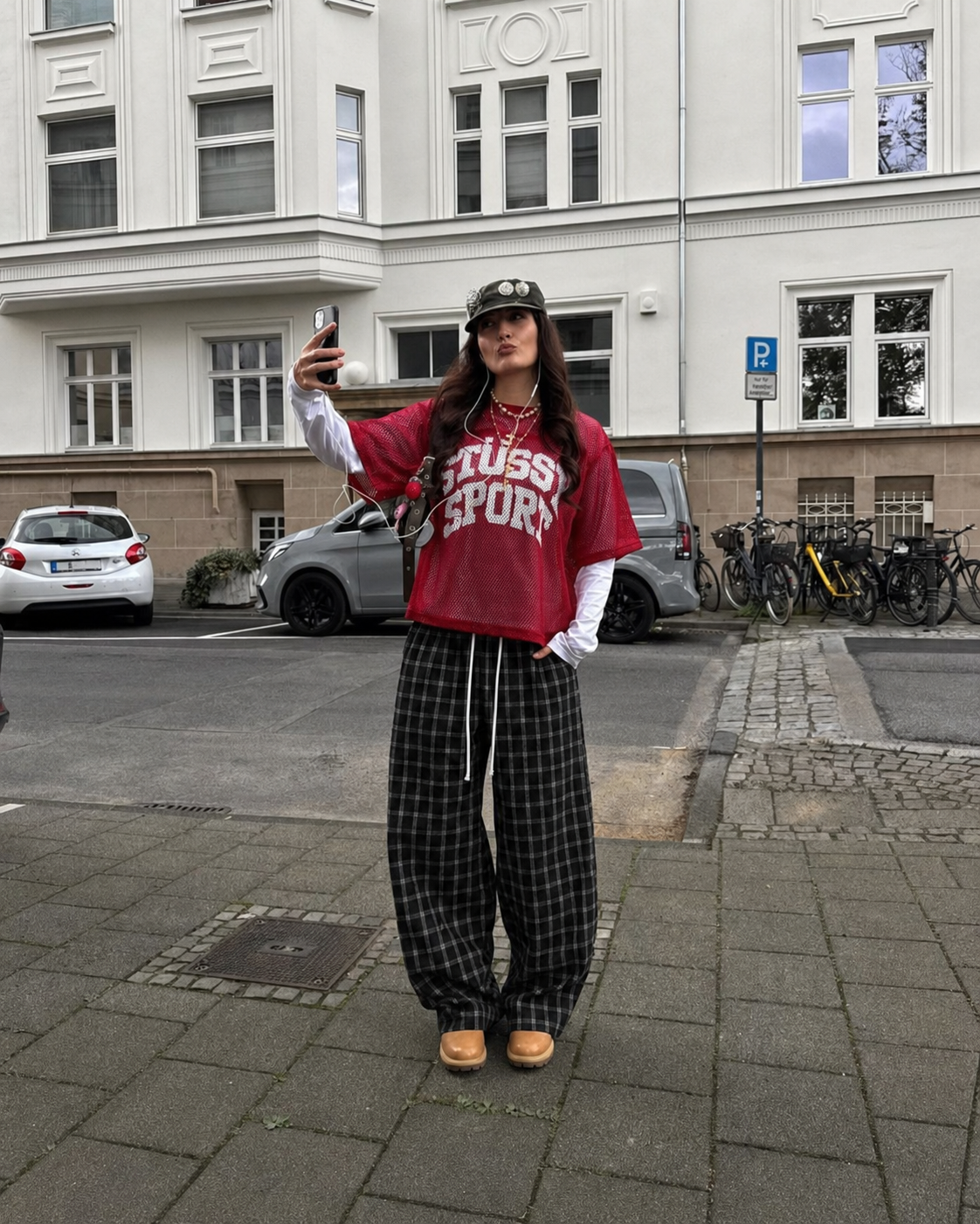 Black plaid pants worn in Y2K streetwear style