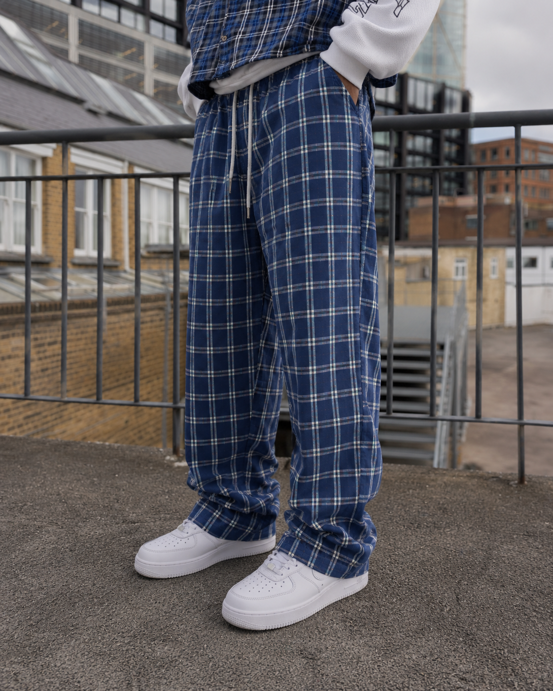 Navy plaid pants lower leg detail with sneakers
