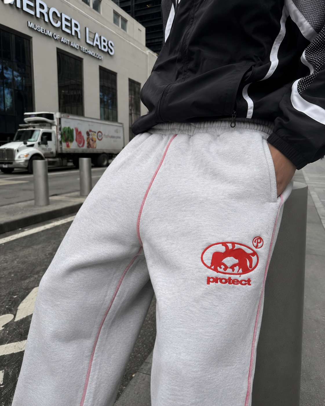 Grey Protect sweatpants red logo and elastic waist detail