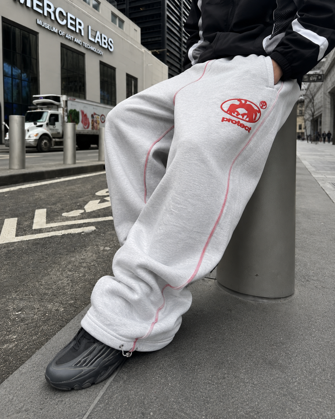 Grey baggy sweatpants stacked hem and ankle drawcord detail