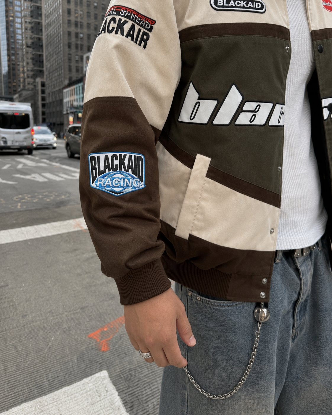 Brown beige racing jacket sleeve patch detail