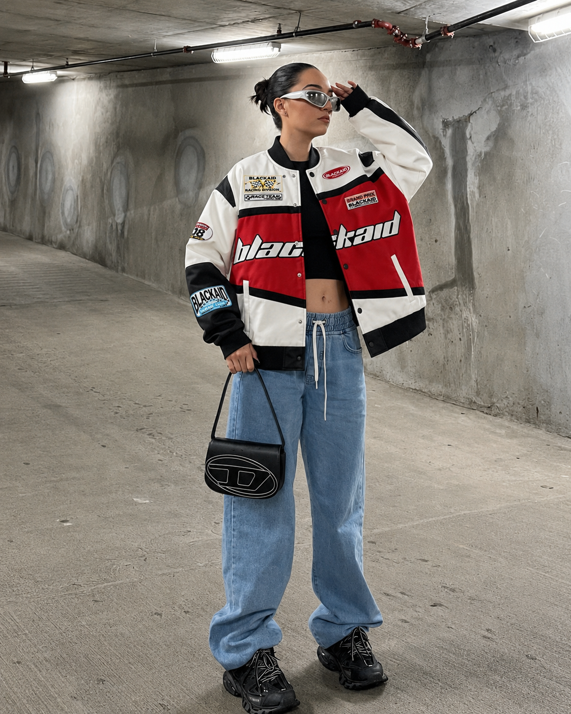 Red racing jacket worn with baggy jeans