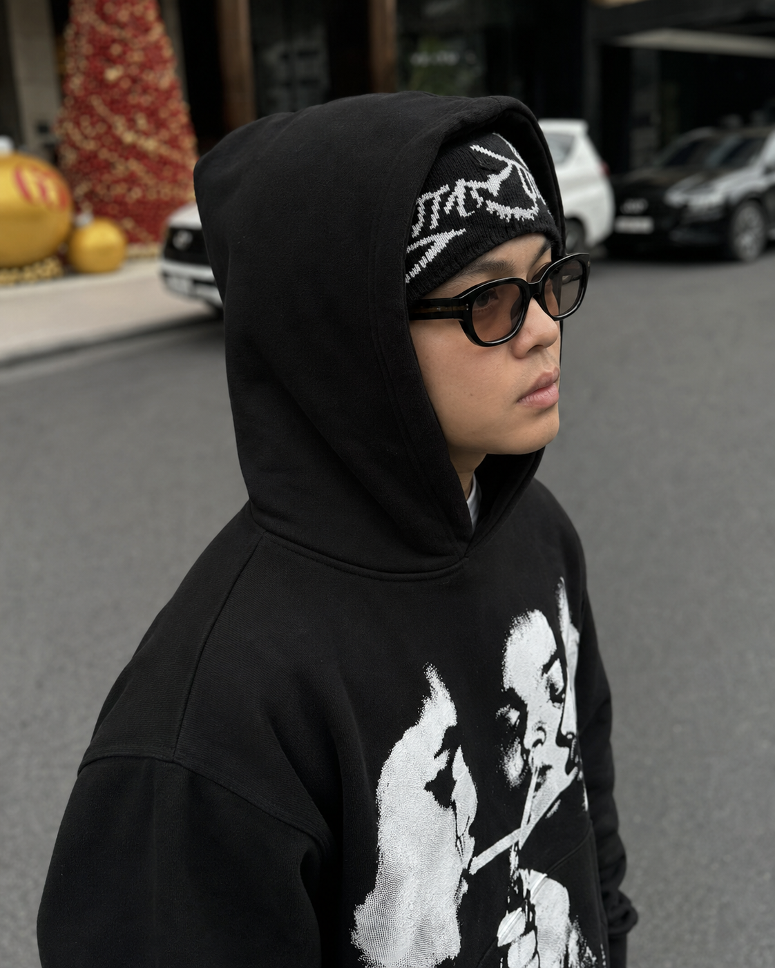 Black graphic hoodie hood and print detail