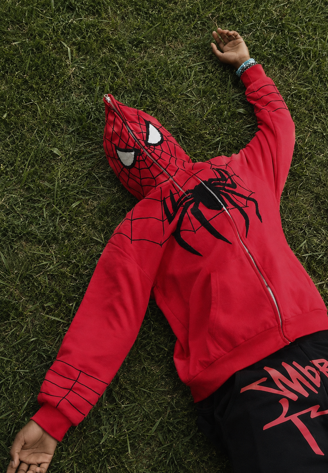 Full Zip Hoodie Spiderman red black worn lying web motif