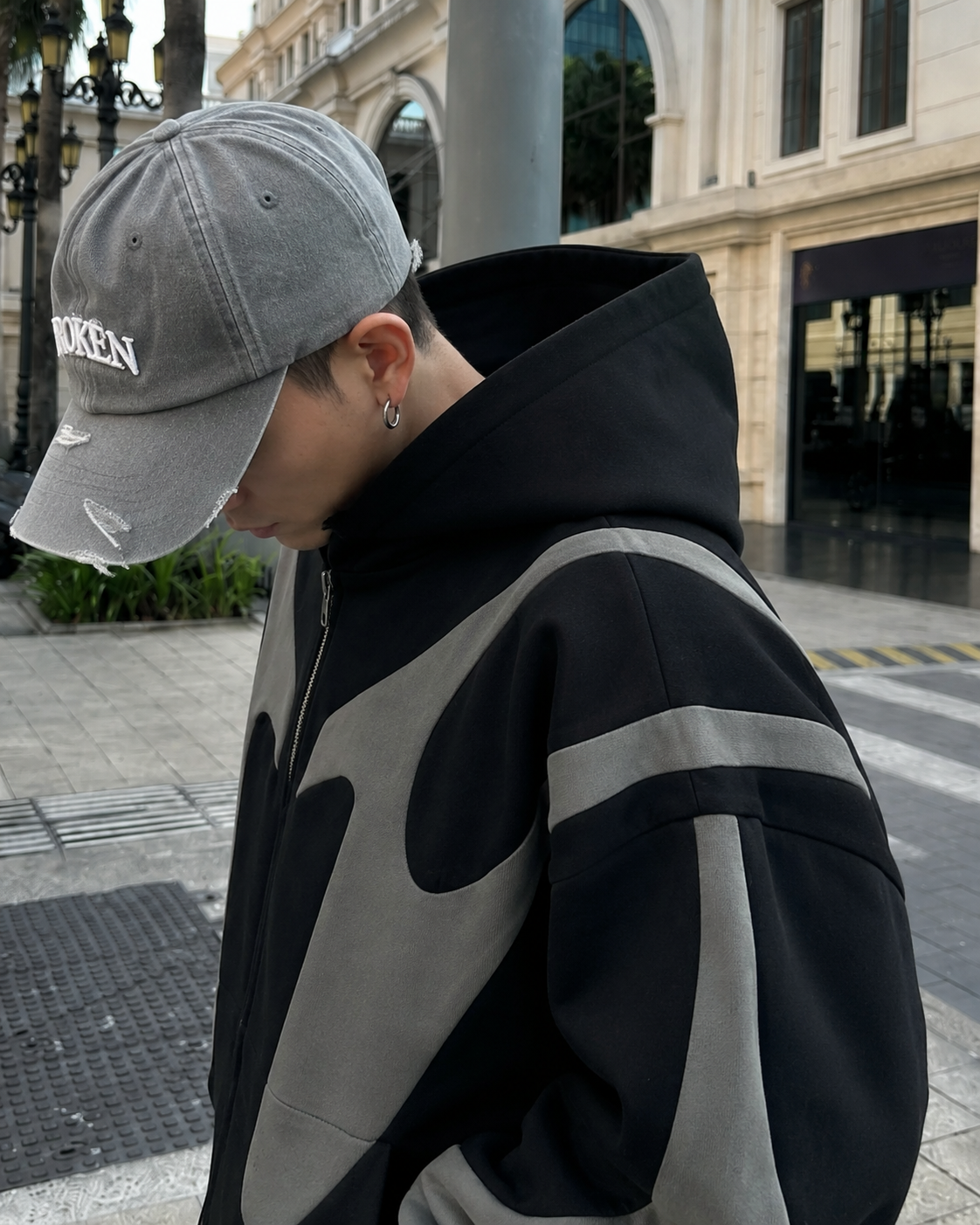 Black Y2K zip up hoodie detail of the contrast panels on the shoulder