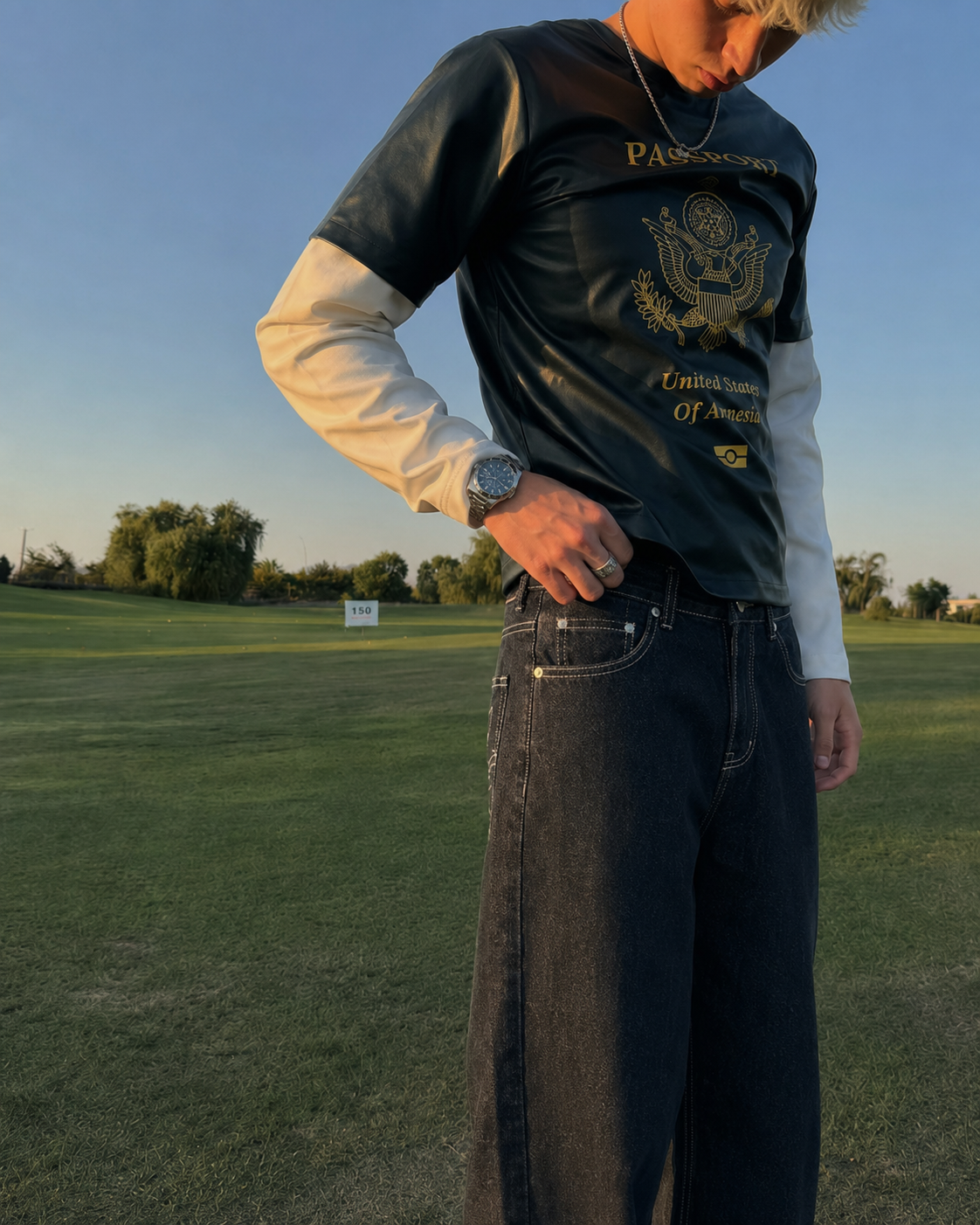 Black embroidered jeans worn front pocket detail