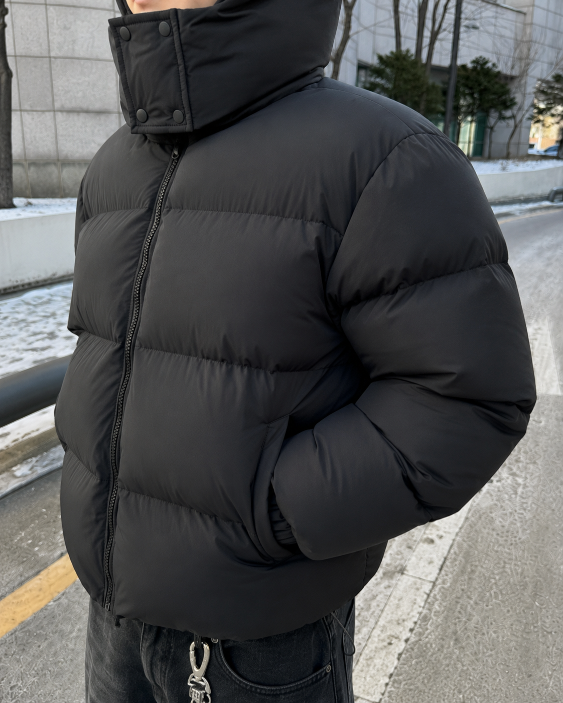 Black padded puffer jacket texture detail voluminous sleeves