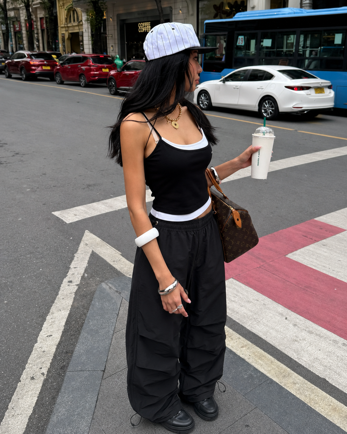Black parachute pants in Y2K streetwear style