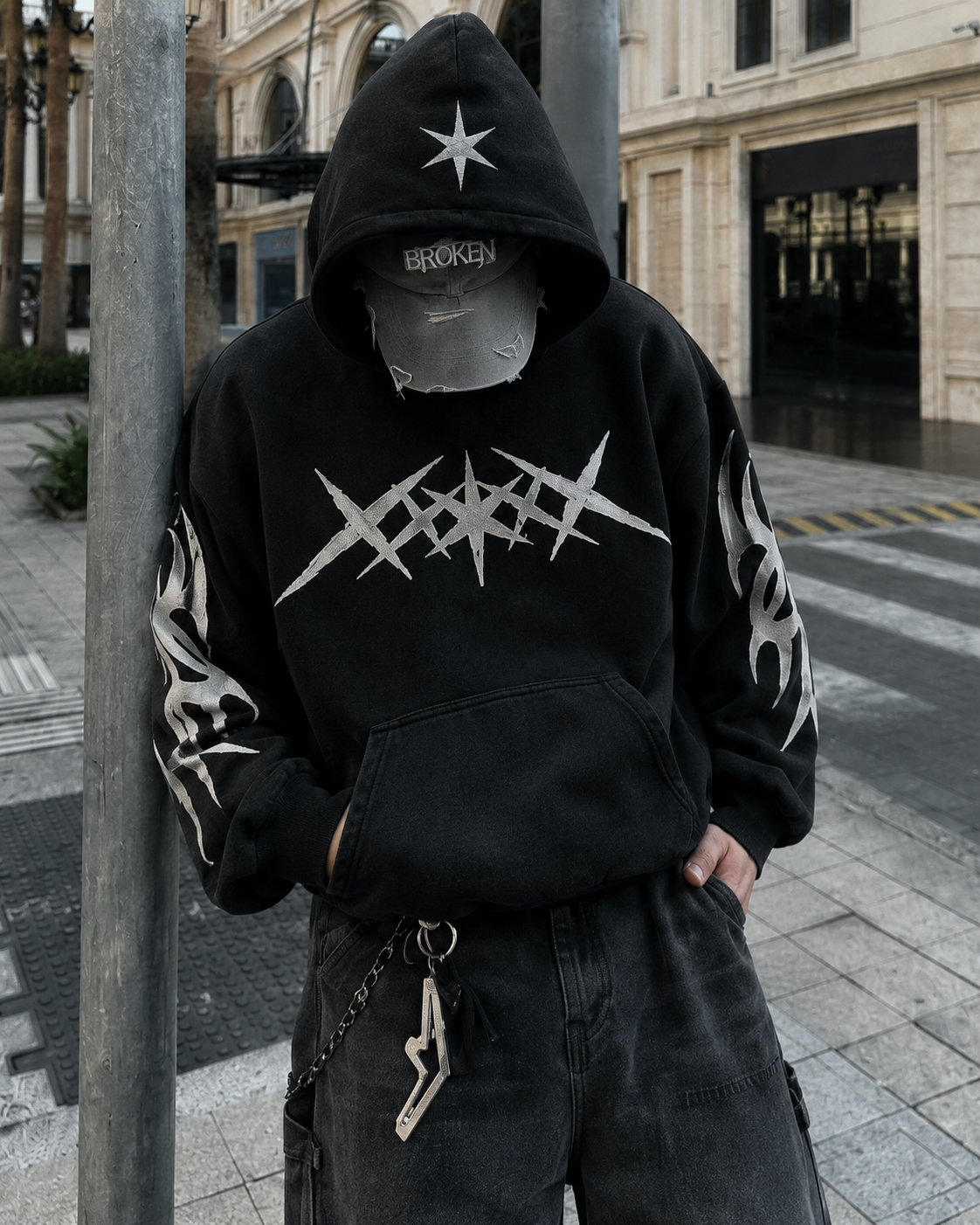 Black star hoodie worn hood and star logo detail