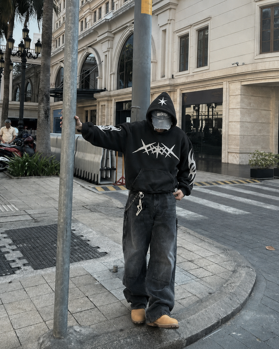 Black star hoodie worn by man Y2K grunge streetwear