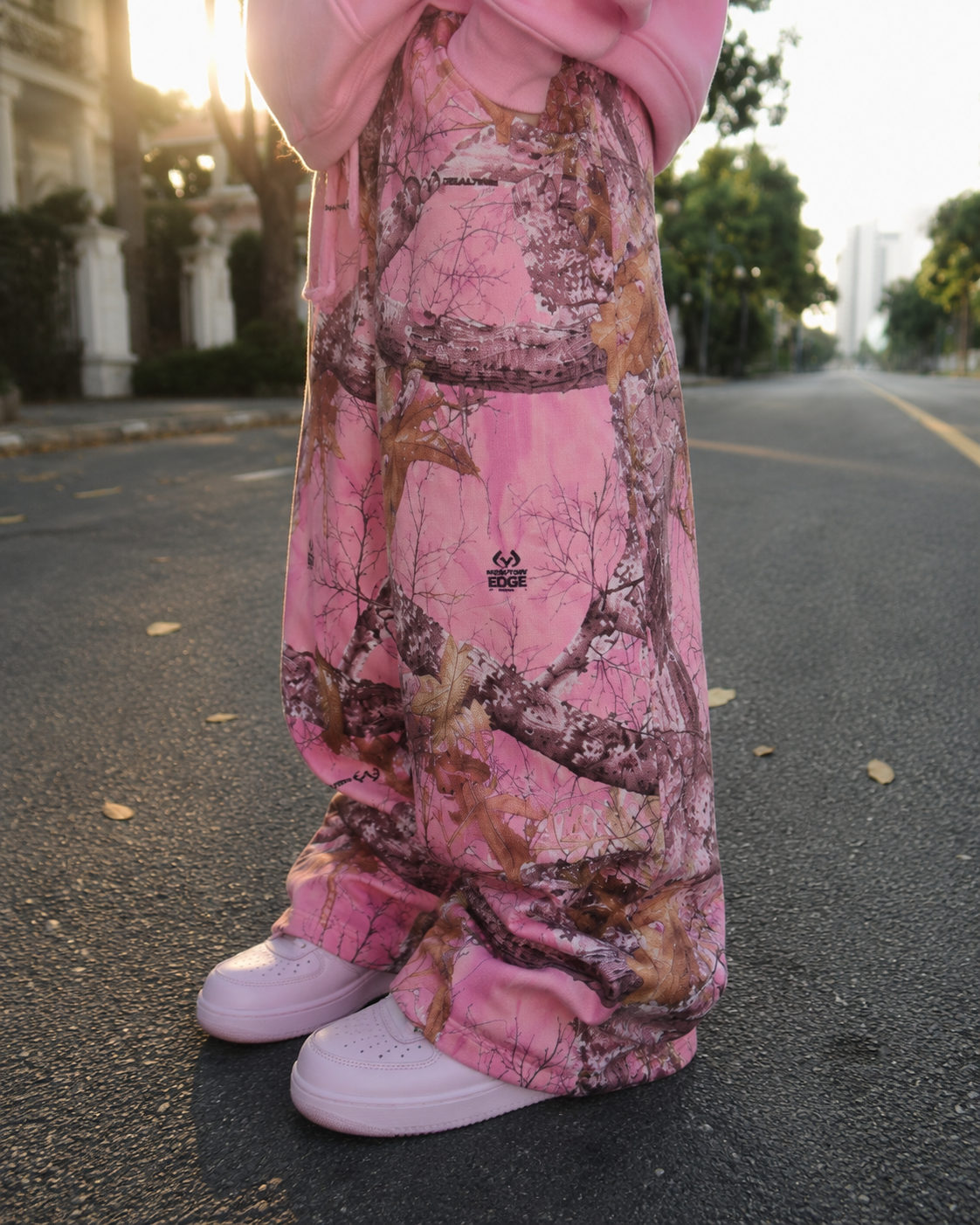 Pink Y2K camo sweatpants stacked hem detail