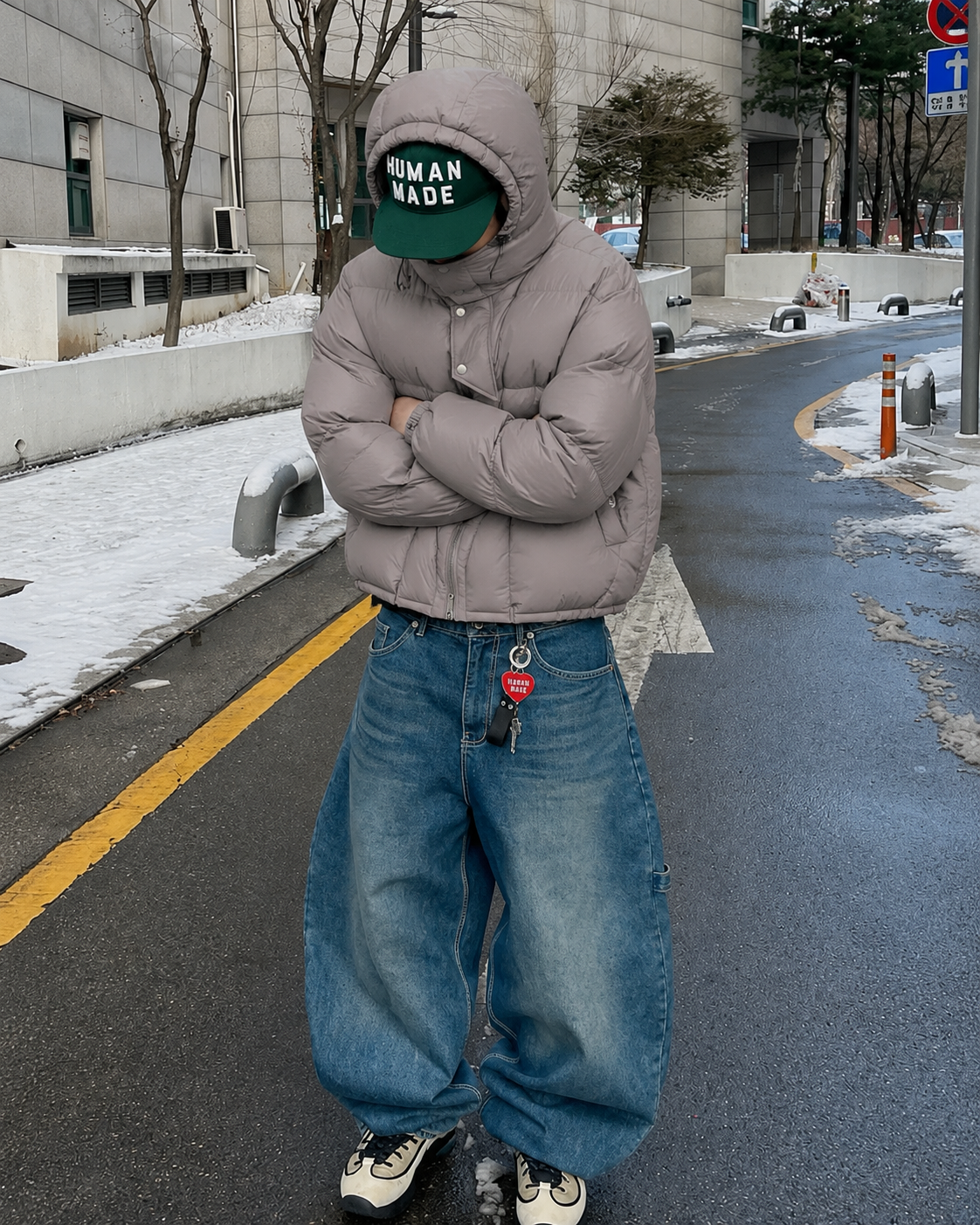 Grey cropped puffer jacket worn with baggy jeans winter outfit