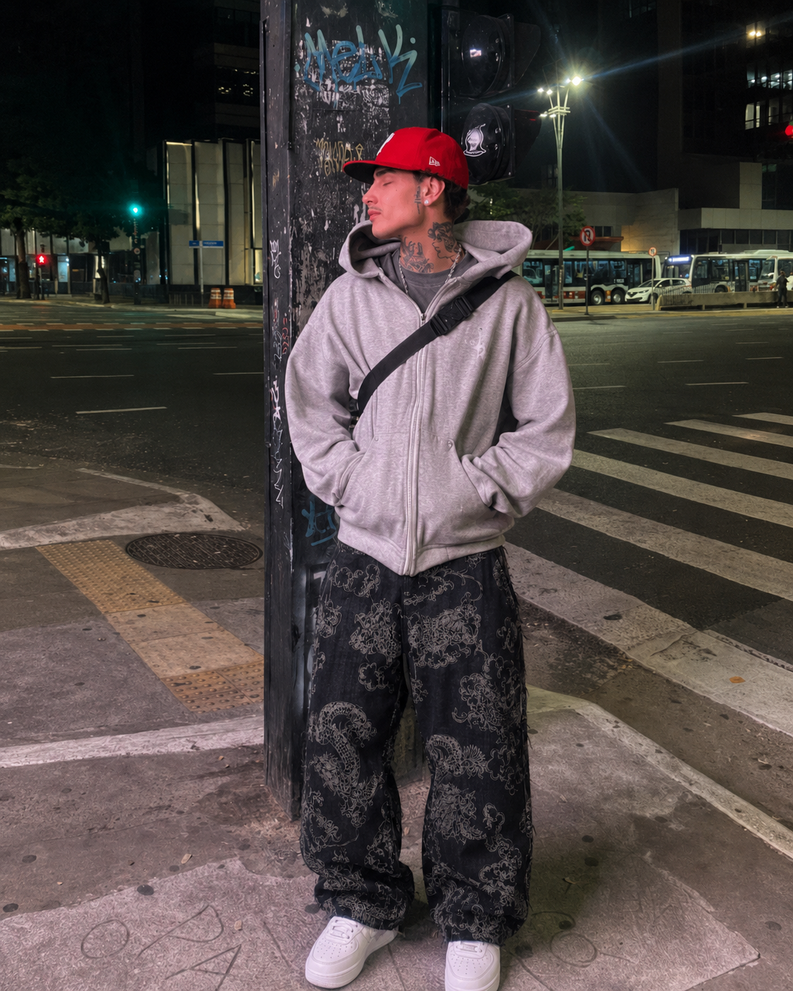 Black dragon pants worn with grey hoodie