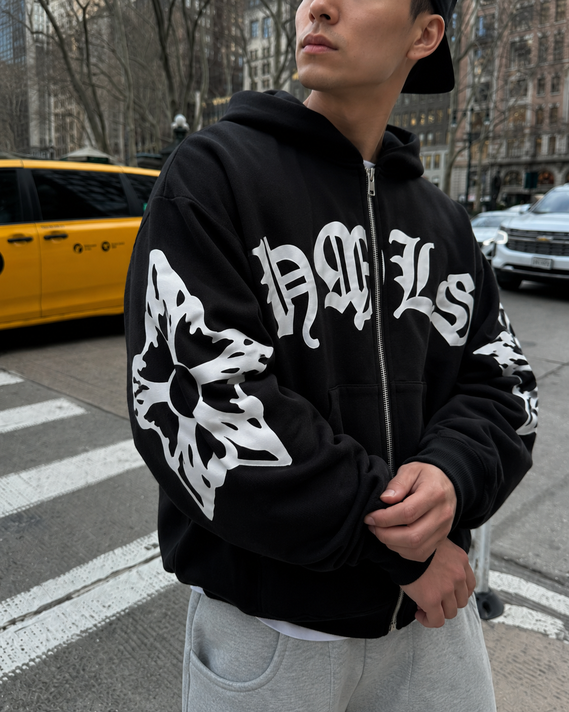 Black gothic zip up hoodie sleeve and white lettering detail