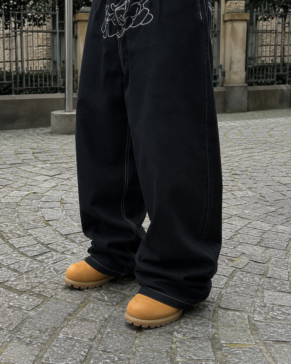 Black graffiti jeans wide-leg detail white contrast stitching