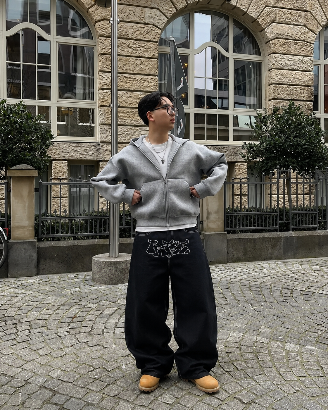 Black graffiti jeans worn Y2K streetwear baggy fit