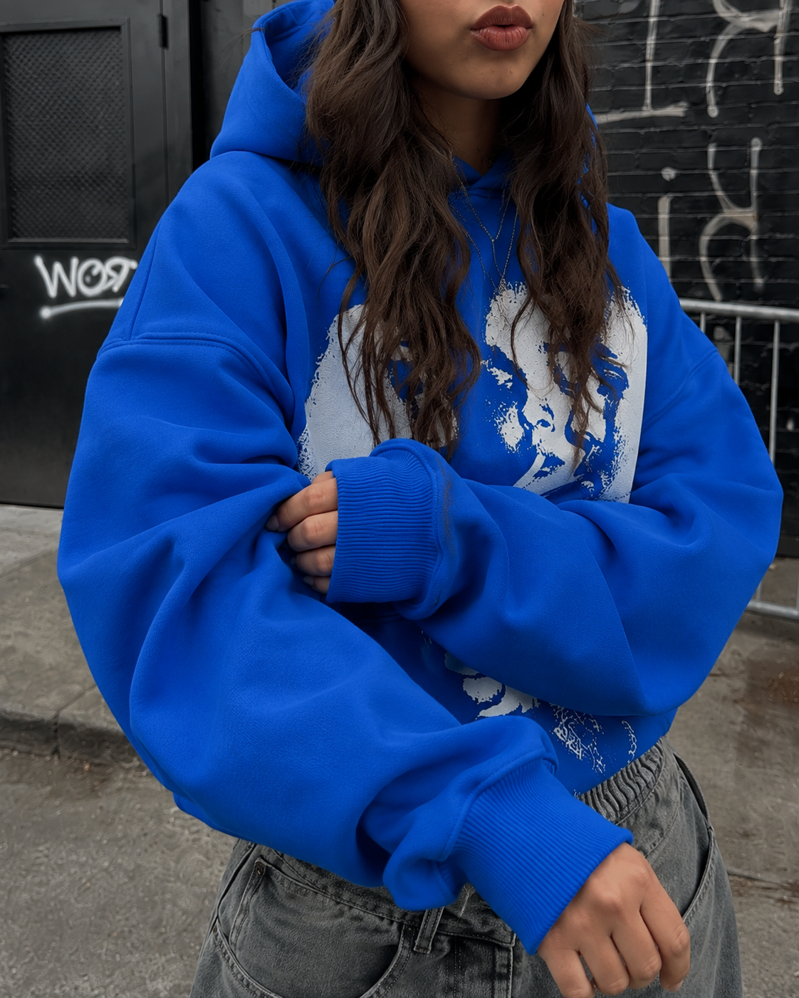 Blue graphic hoodie chest and sleeve detail