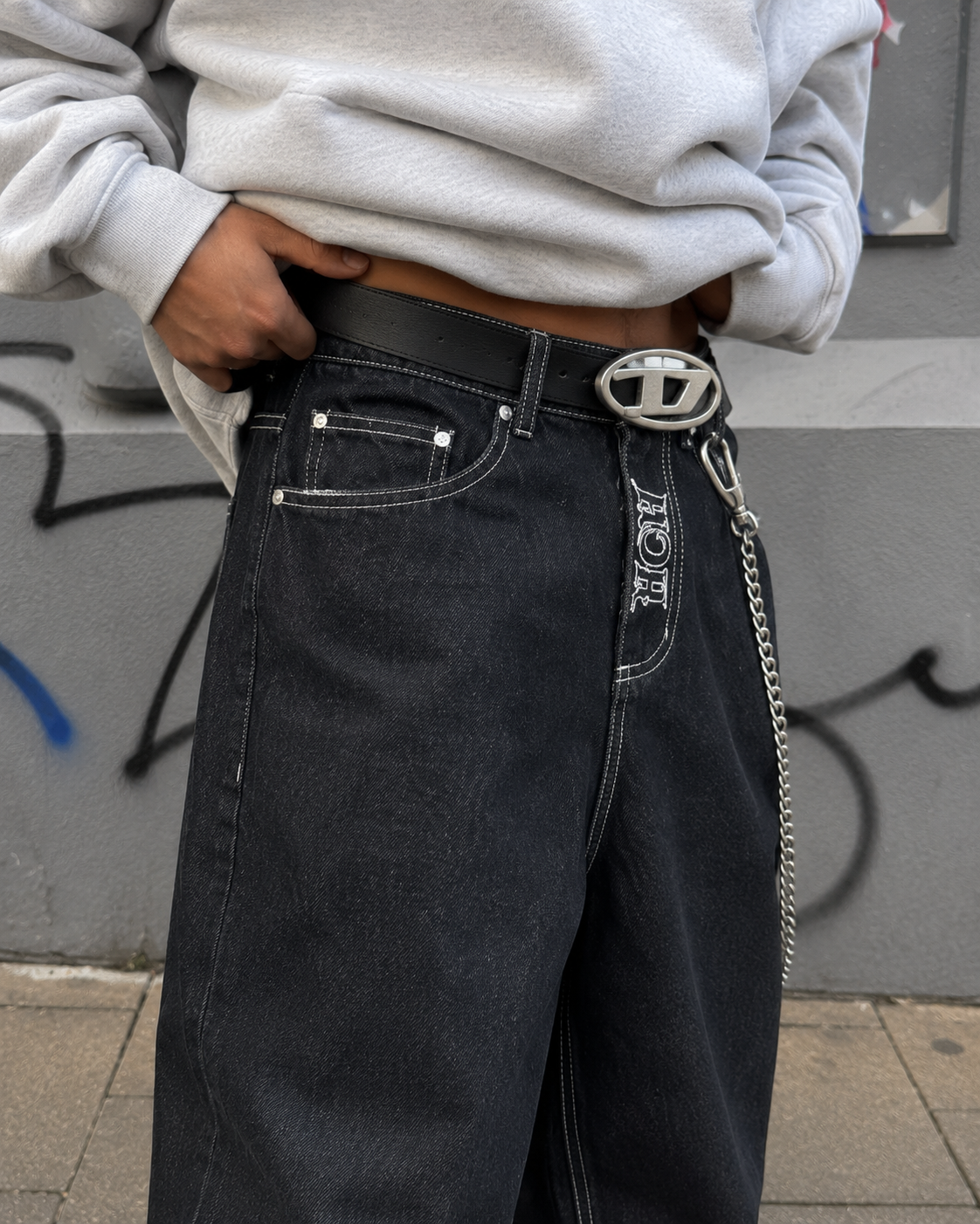 Close-up front embroidery on black jeans
