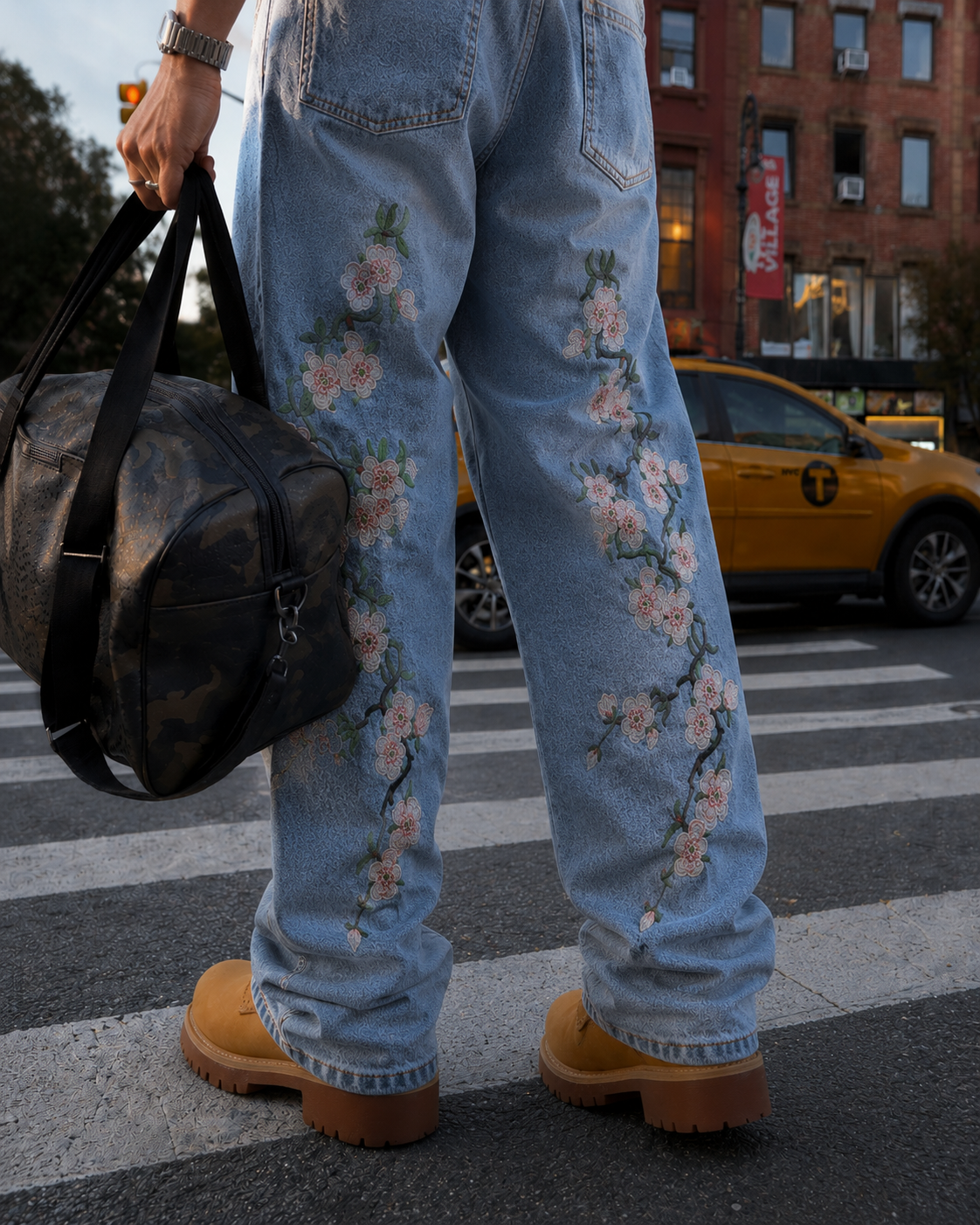 Blue flower jeans leg embroidery detail