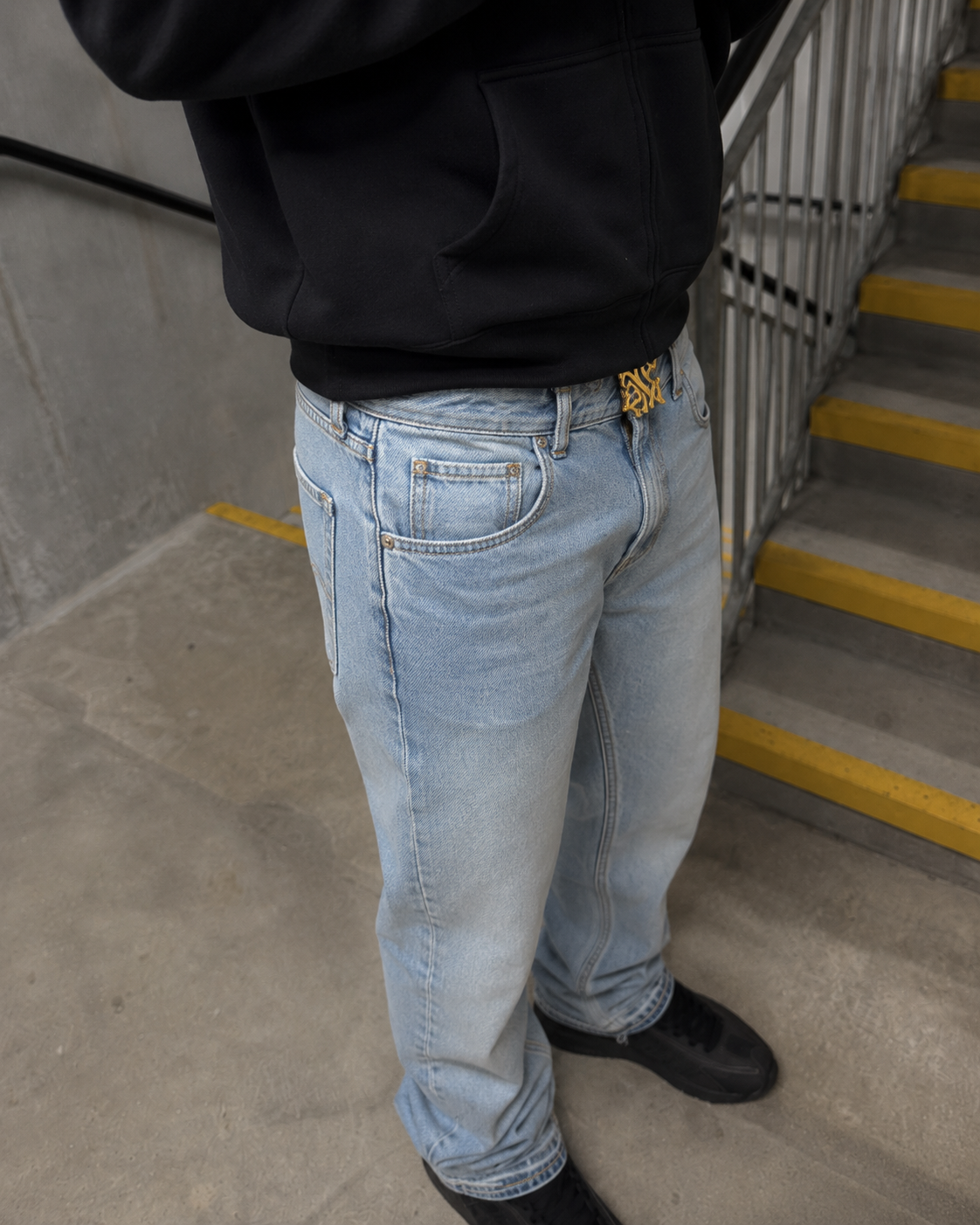 Light blue flare jeans waist and front pocket detail