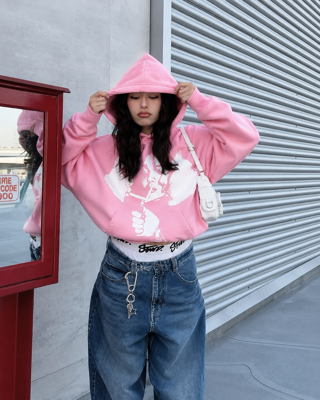Pink graphic hoodie worn Y2K streetwear