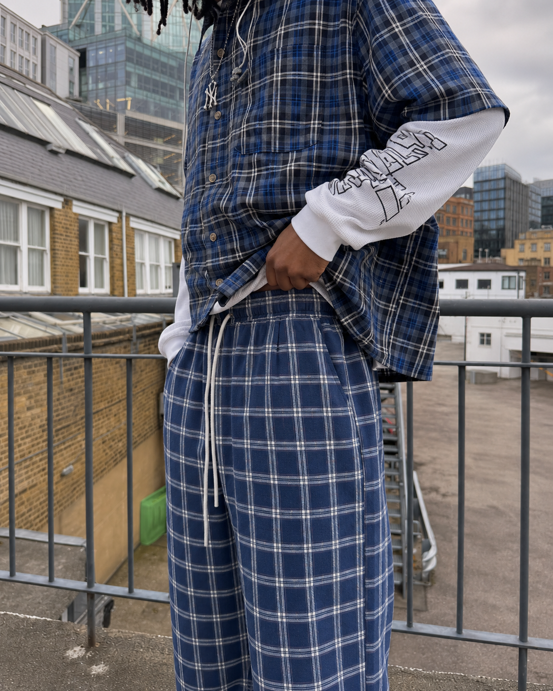Navy plaid pants drawstring waist detail worn