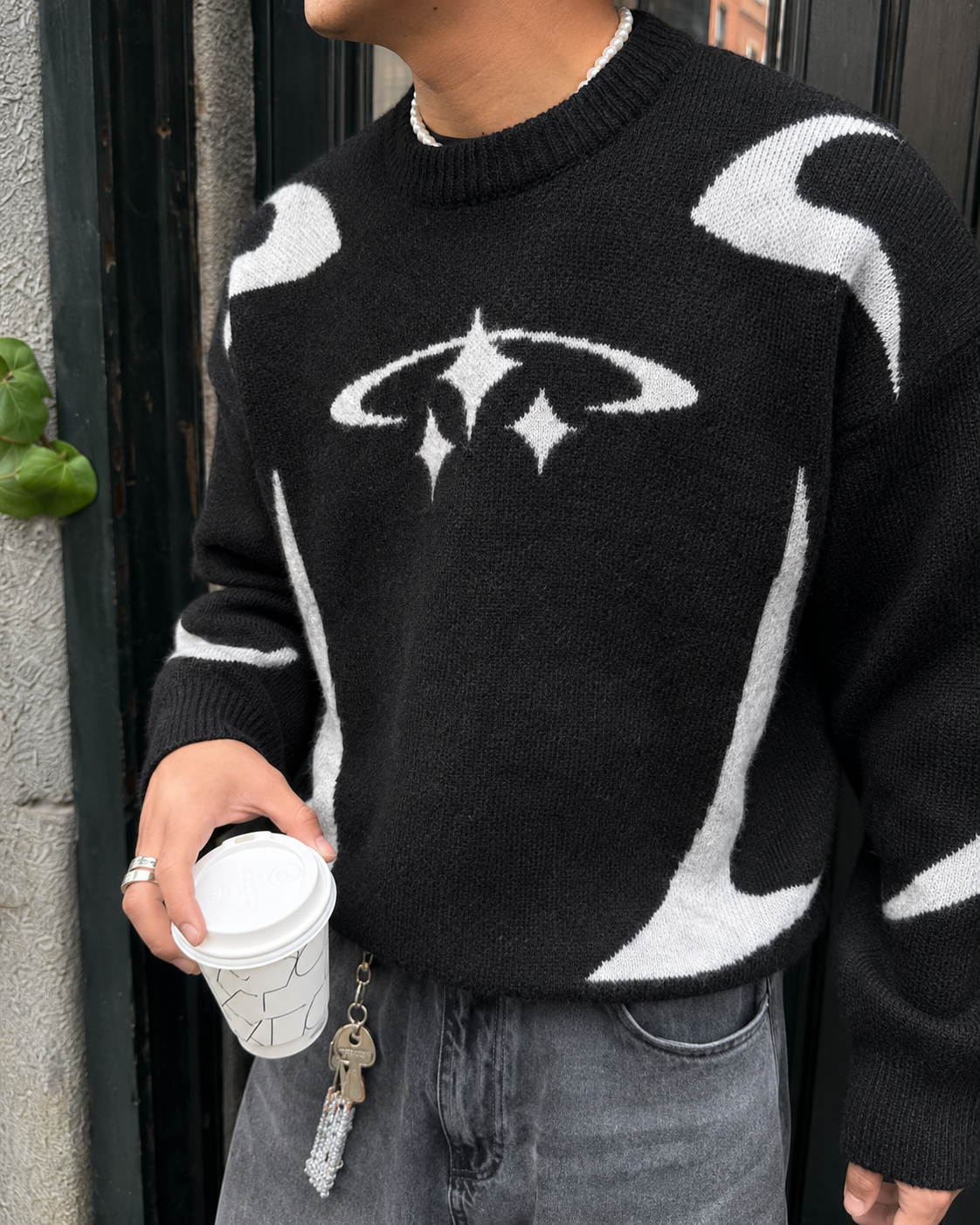 Black Y2K sweater star motif chest detail