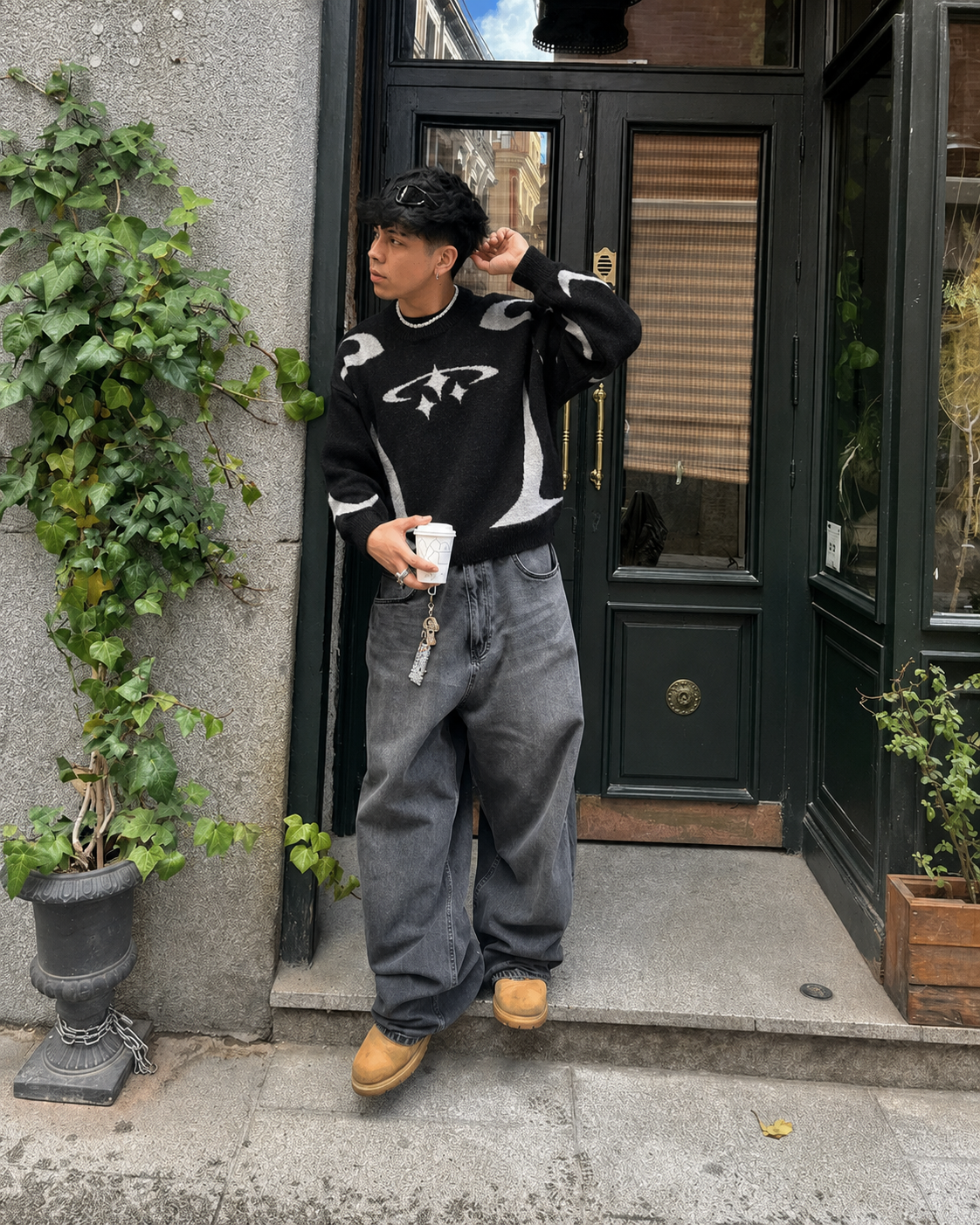 Black Y2K graphic knit sweater worn front view