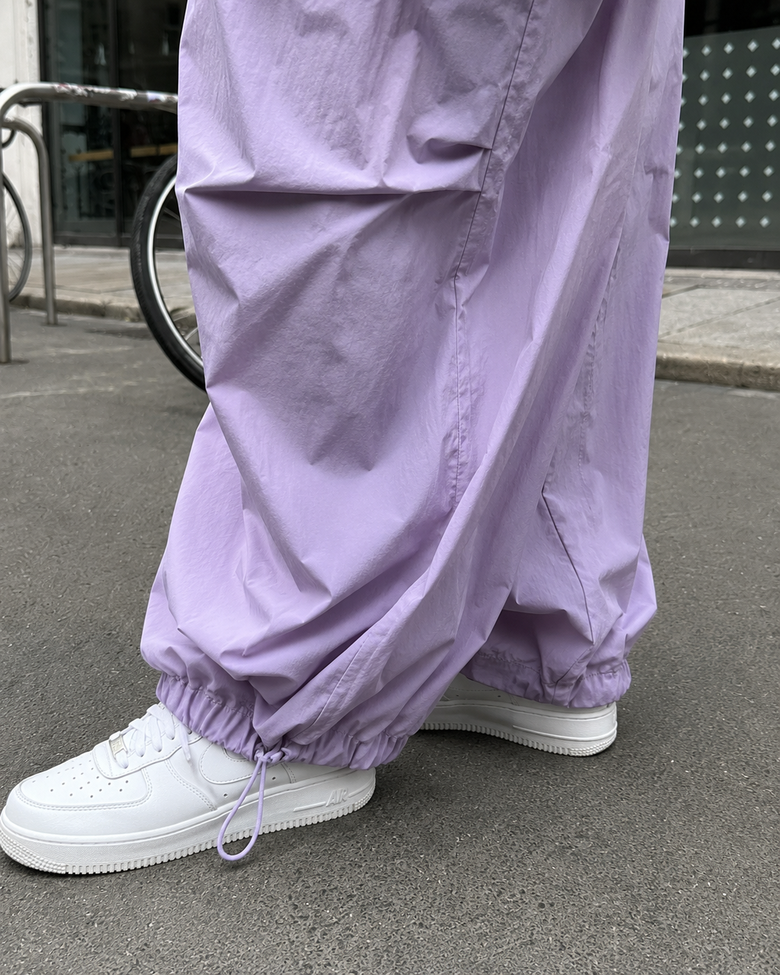 Purple parachute pants adjustable hem detail