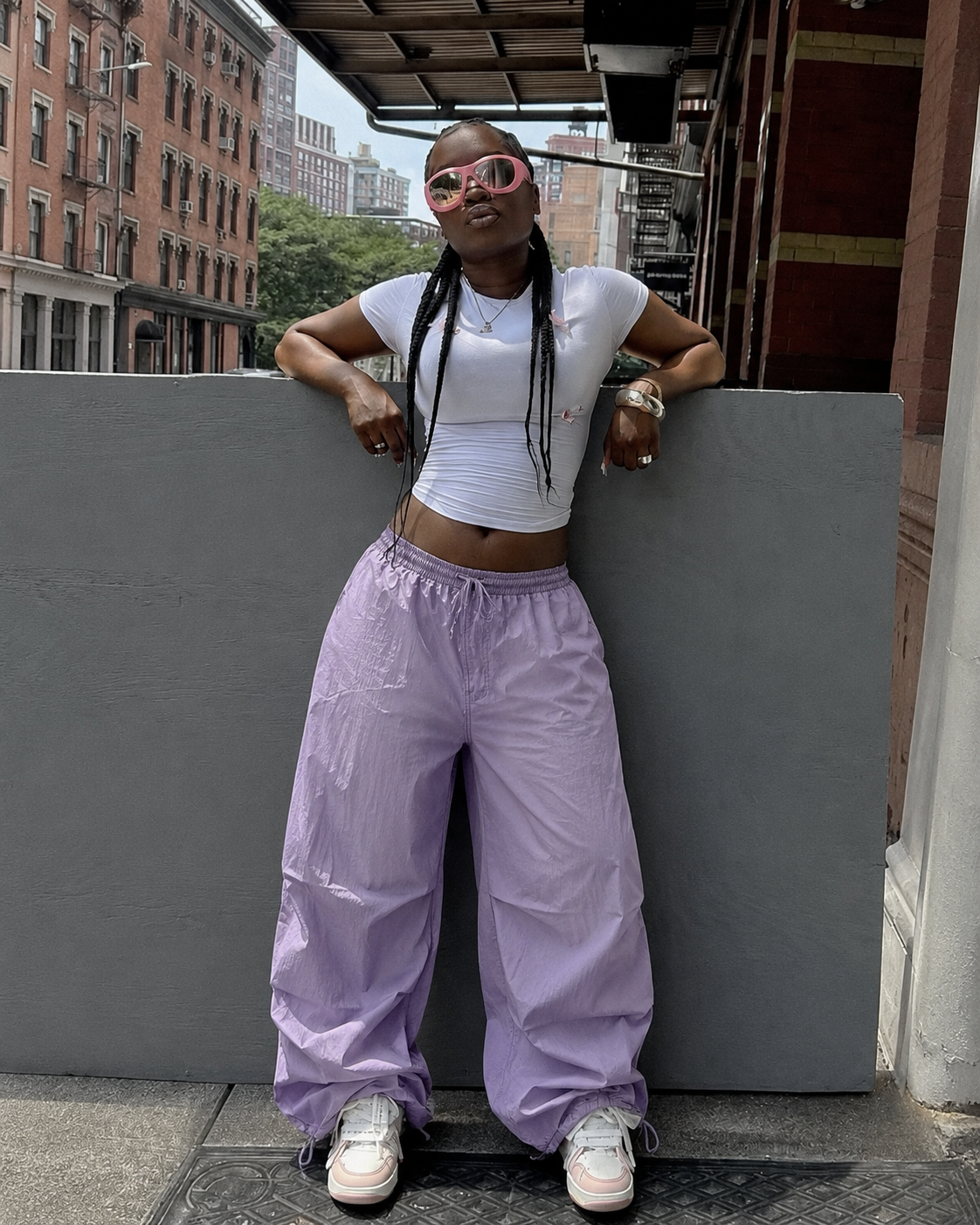Purple streetwear parachute pants worn
