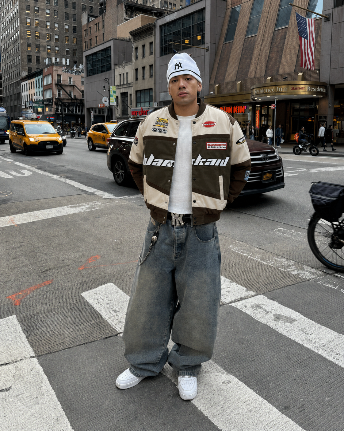 Brown beige racing jacket worn with baggy jeans