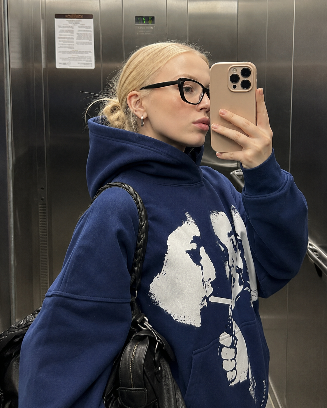 Navy graphic hoodie hood and print detail