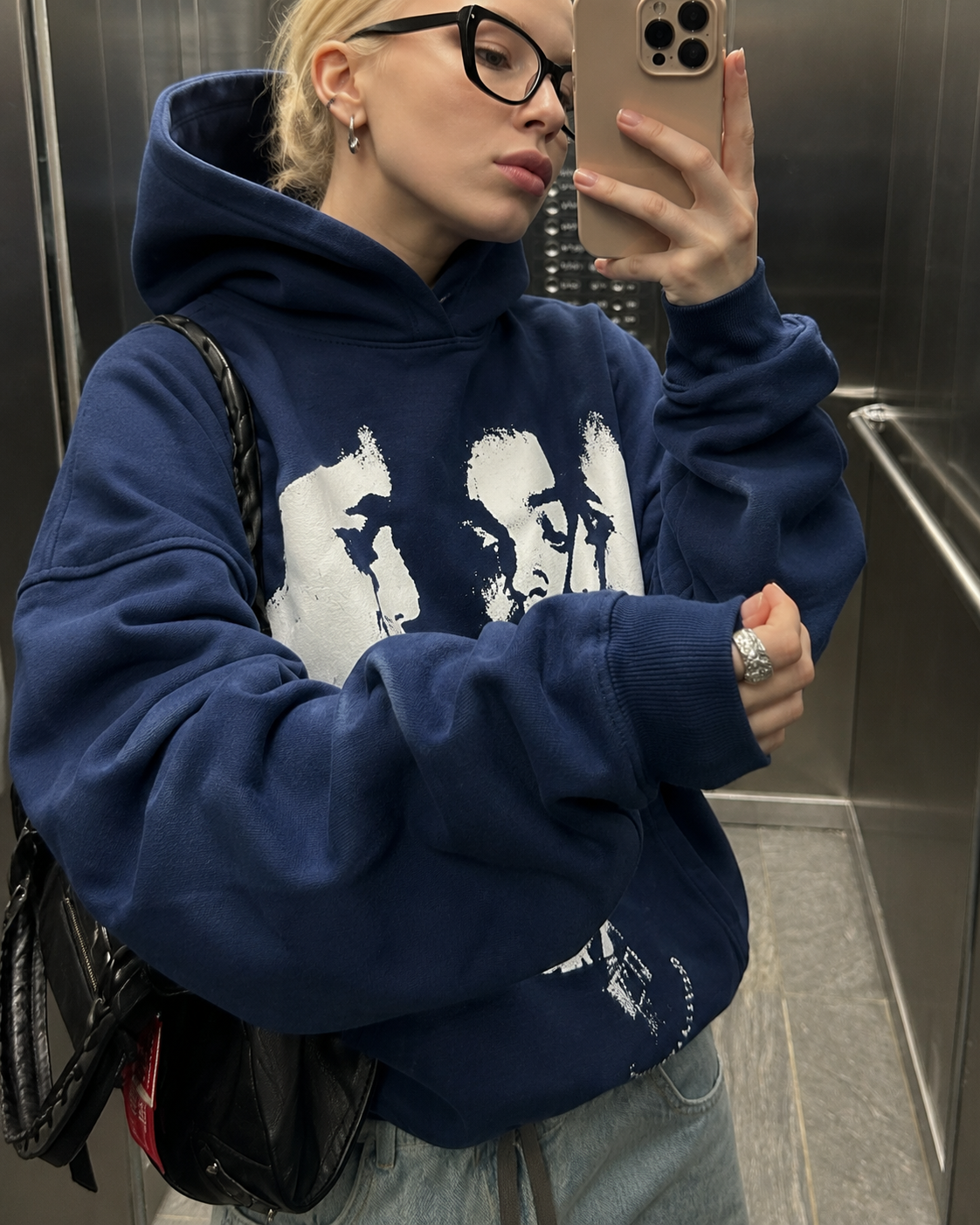 Navy graphic hoodie sleeve and print detail