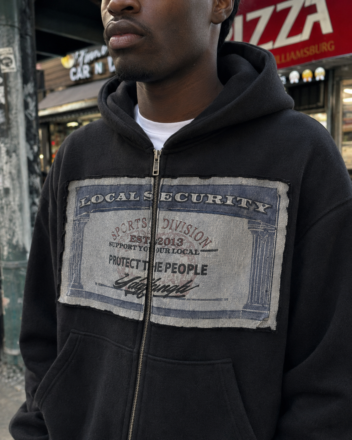 Social Security patch detail on black zip up hoodie