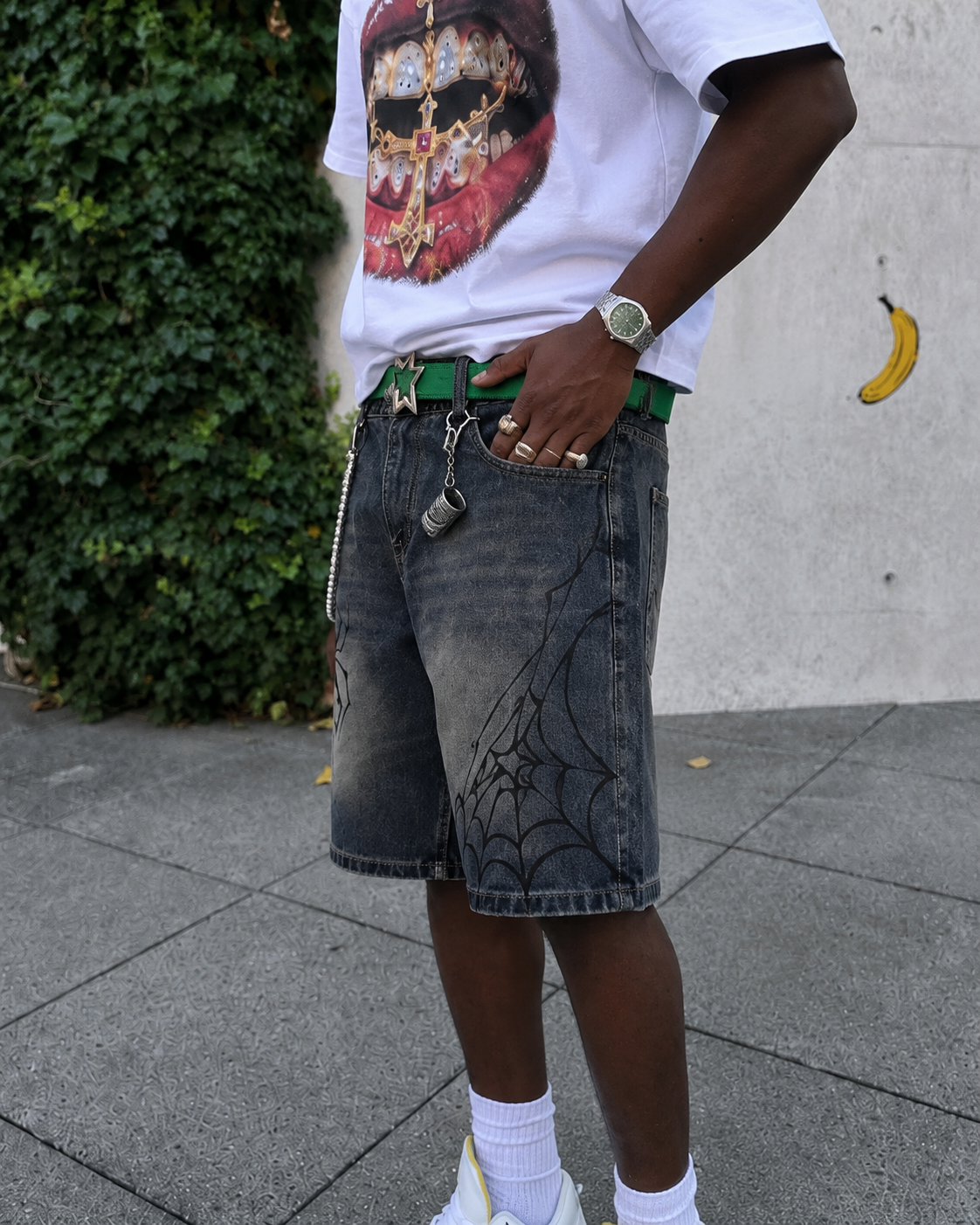 Spider Shorts worn with spider web graphic on the right leg