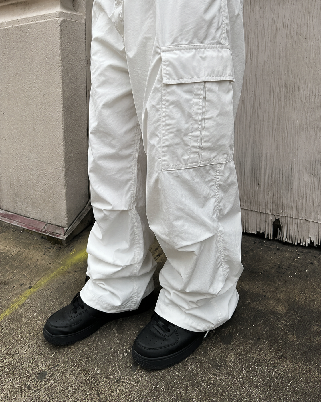White parachute pants cargo pocket and balloon leg detail