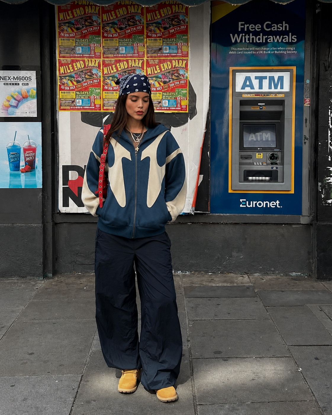Blue Y2K zip up hoodie with cream contrast panels worn from the front